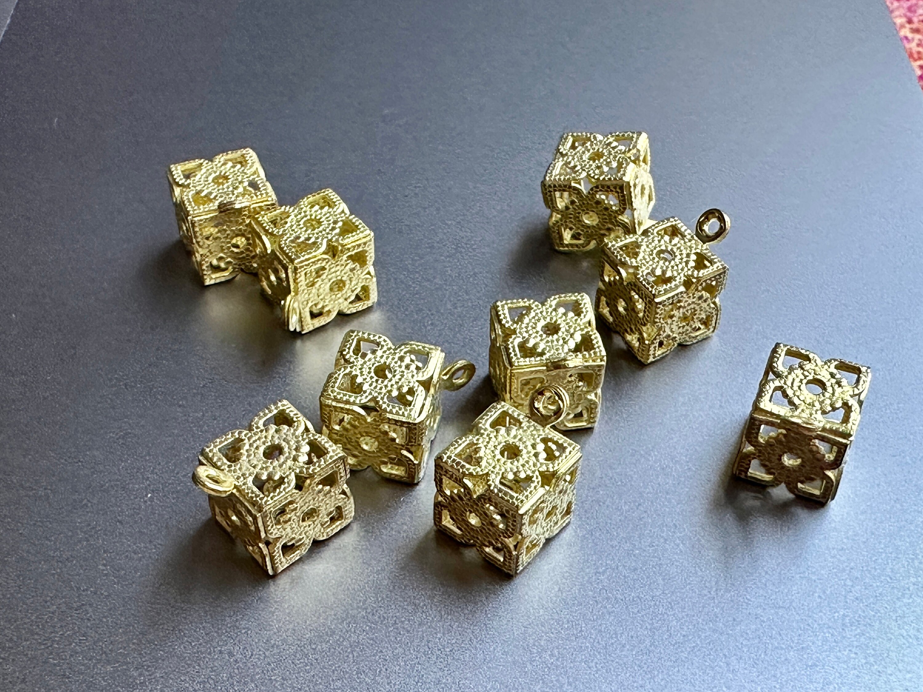 I seriously geeked out when I found these vintage brass filigree charms! Absolutely fun and FUNKY! Sold per 8 pieces. SKU 15008