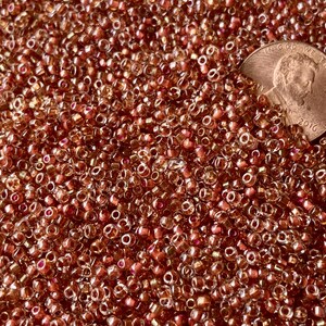 Beautiful strawberry slush-like color in these 11/0 seeds! From the high end DC estate. Sold per 25 grams. SKU 07005