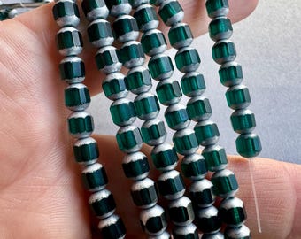 Lovely Czech pressed glass beads! 6mm faceted cathedral cut. Sold per strand. SKU 17006