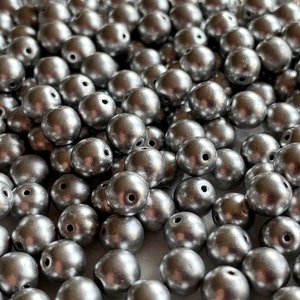 STUNNING silver metallic finished Czech glass druks! Sold per 50 beads. SKU 01431