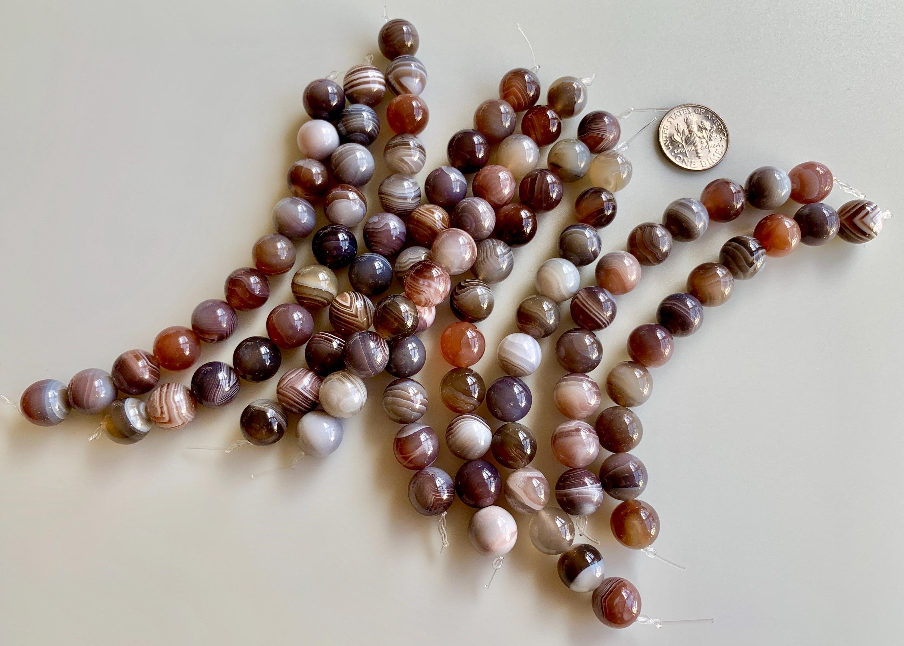 Lovely banded agate rounds! Sold per strand/lot of 11 beads. SKU 02114