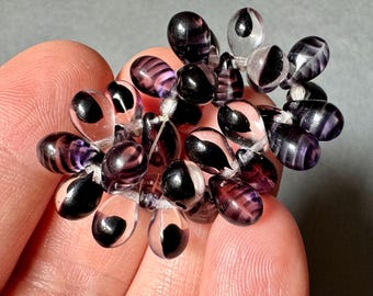 Czech pressed glass teardrops in amethyst striped clear and amethyst droplets encased in clear!  STRIKING! Sold of 30 beads. SKU 14824