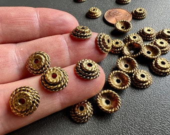 Substantial brass ox finished bead caps. Twisted rope style that reminds me of certain basket tops!