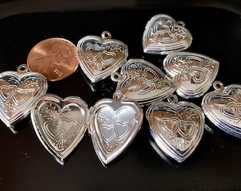 These gorgeous embossed silver plated lockets open and close with ease!