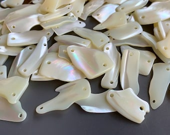 Incredible vintage Japanese two holed mother of pearl components! Fabulous luster! Sold per lot of 12 pieces. SKU 13219