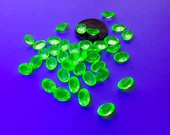 Magnificent RARE Swarovski TTC peridot stones. Table faceted, extra facets all around the stone. Glows under a black light!