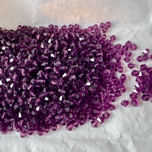 Amazing amethyst Swarovski bicones! Pristine quality, new from the tissue pack! Sold per 36 beads. SKU 01730