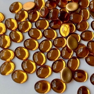 Terrific vintage West German topaz foil backed glass cabs!