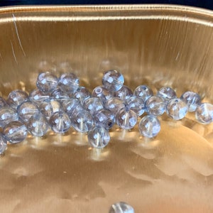 Lovely light shade of blue Czech glass druks! Unusual finish.