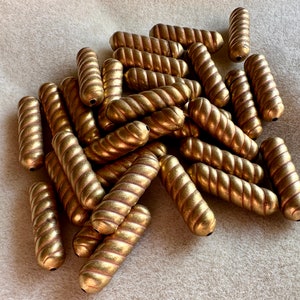 Charming vintage brass beads! These remind me of a certain pasta shape! Sold per lot of four beads. SKU 15013