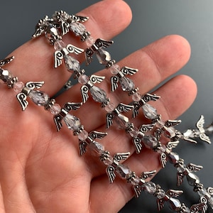 Lovely &#39;angel&#39; strands!  Gorgeous fire polished glass and silver plated metal wings!