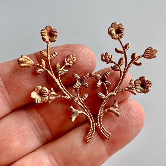 Very unusual finish on these vintage, new old stock stampings! Like a light honey rose gold taupe. Unusual! Sold per piece. SKU 08701