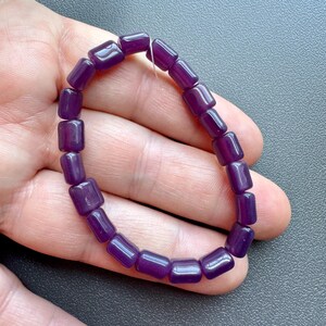 Funky grape candy colored Czech glass pillows! Sold per strand. SKU 10216