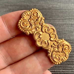 Light copper penny patina on these gorgeous vintage Haskell stampings! Sold per piece. SKU 13909