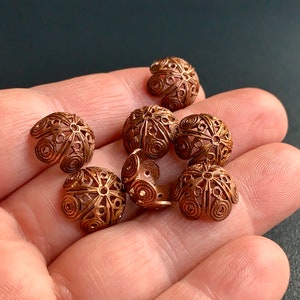 Some of the best vintage bead caps I have ever come across! From the Miriam Haskell buyout. Sold per four pieces. SKU 14321