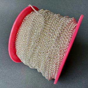 I ADORE this variation on a Rolo chain!! Bright silver plated brass chain. Sold per TWO yards. SKU chain615