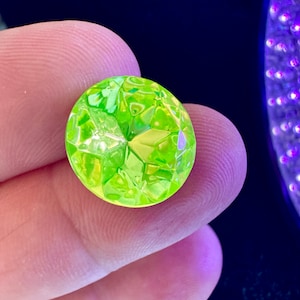 RARE and absolutely stunning UV reactive large rhinestones. Jonquil in daylight/glow under a black light. Sold per two pieces. SKU 15504