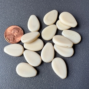 Gorgeous large pressed glass flat Czech top drilled drops! Gorgeous creamy ivory glass! Sold per eight beads. SKU 09106