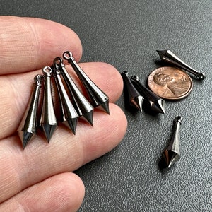 Very well made solid brass pointy pendulum charms from the Haskell buyout! Sold per pair. SKU 08206