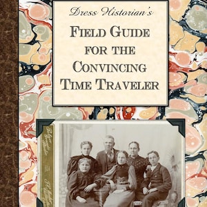 May include: A vintage book cover with a marbled design in shades of red, black, and cream. The title reads "Dress Historian's Field Guide for the Convincing Time Traveler". An old photograph of a family is featured on the cover.