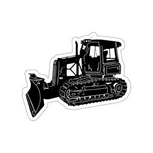 Könnte beinhalten: Schwarz-weiße Silhouette eines Bulldozers mit einer großen Schaufel. Der Bulldozer ist nach rechts ausgerichtet.