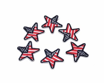Pode incluir: Seis patches em forma de estrela vermelho, branco e azul para passar a ferro com um design de bandeira americana.