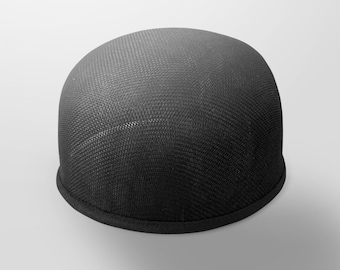 May include: A black mesh cap with a rounded crown and a short, curved brim. The cap has a textured surface and a solid black trim around the base. The hat is designed for casual wear.