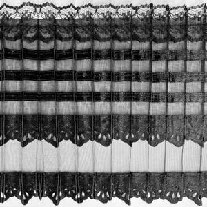 May include: Black and white striped sheer curtain valance with a scalloped lace trim. The valance has a delicate, feminine design.