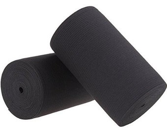 May include: Two rolls of black elastic fabric, each rolled up and ready to be used for sewing projects.