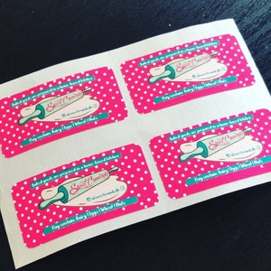 May include: Four pink and white polka dot stickers with the text "Baked goods are prepared in a home-based kitchen" and the logo "Sweet Crumbs" with a rolling pin graphic. The text "May contain: Dairy | Eggs | Wheat | Nuts" is also included on each sticker.