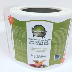 May include: A set of six bath bombs, each weighing 2.4 ounces, packaged in a white and green label with a bathtub illustration. The label reads "Sculp a Soap" and "Where Wellness and Quality blend together to create the Ultimate Bath Bomb!" The bath bombs are scented with 100% essential oils and are vegan, gluten-free, and all-natural.