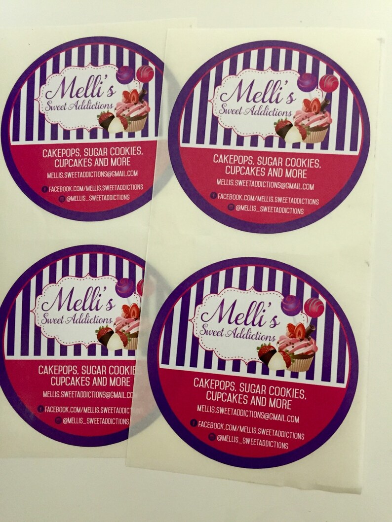 May include: Four round stickers with a purple and white striped background. The stickers feature a logo with the text "Melli's Sweet Addictions" and a cupcake with pink frosting and strawberries. The text "Cakepops, Sugar Cookies, Cupcakes and More" is printed below the logo. The text "MELLIS.SWEETADDICTIONS@GMAIL.COM", "FACEBOOK.COM/MELLIS.SWEETADDICTIONS", and "@MELLIS_SWEETADDICTIONS" are printed below the text.