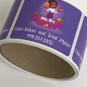 May include: Purple and white sticker with the text "Ms. B's" and "Cake Baker and Treat Maker" with a phone number. The sticker features a cartoon illustration of a woman holding a cake.