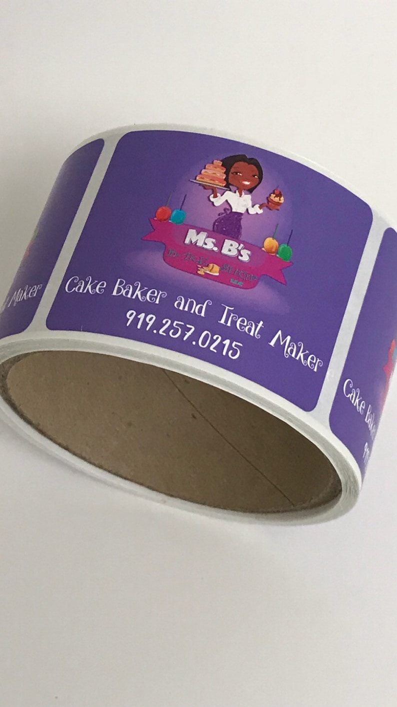 May include: Purple and white sticker with the text "Ms. B's" and "Cake Baker and Treat Maker" with a phone number. The sticker features a cartoon illustration of a woman holding a cake.