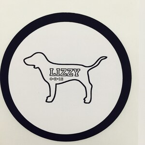 May include: Black and white silhouette of a dog with the name "Lizzy" and the date "4-2-16" printed on a white circle with a black border.