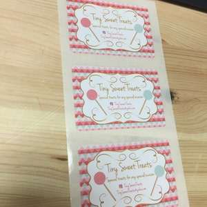 May include: Three white square stickers with a pink and blue chevron pattern. The stickers have a gold border and say "Tiny Sweet Treats" in a gold script font. The text says "Special treats for any special occasion" and includes the social media handle "Tiny Sweet Treats".