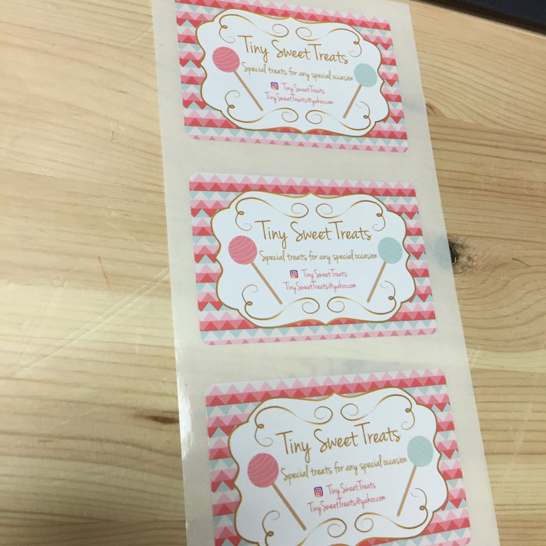May include: Three white square stickers with a pink and blue chevron pattern. The stickers have a gold border and say "Tiny Sweet Treats" in a gold script font. The text says "Special treats for any special occasion" and includes the social media handle "Tiny Sweet Treats".