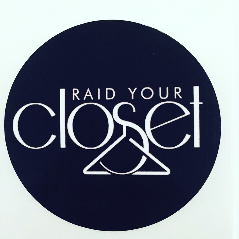 May include: A navy blue circle with the text "RAID YOUR CLOSET" in white. The "S" in closet is a stylized hanger.