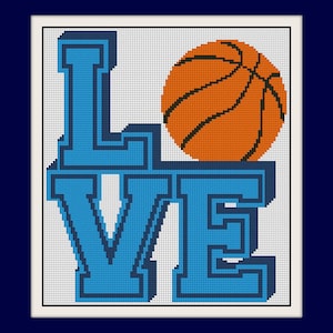May include: A cross-stitch design featuring the word "LOVE" in light blue, 3D block letters. An orange basketball with black lines sits above the "VE". The design is set against a white background with a dark blue border.