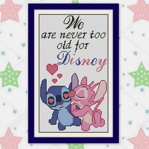 May include: Cross-stitch artwork in a dark blue frame featuring Stitch and Angel from Lilo & Stitch. The text reads "We are never too old for Disney" with hearts. The background has a pattern of pastel stars.