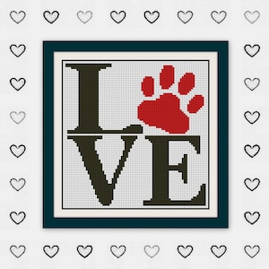 May include: A cross-stitch design with the word "LOVE" in dark green letters and a red paw print. The design is framed in a dark teal border and set against a white background with a pattern of hearts.