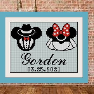 May include: A cross-stitch pattern featuring a cartoon couple dressed as Mickey and Minnie Mouse. The groom is wearing a tuxedo and a fedora hat. The bride is wearing a white dress and a red bow. The text "Gordon 05.25.2021" is below the couple.
