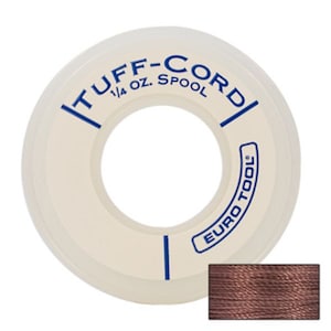 May include: A white spool of 1/4 oz. Tuff-Cord soldering wire with blue lettering and a blue line down the center. The spool is labeled "Tuff-Cord" and "Euro Tool". A close-up of the brown soldering wire is shown below the spool.