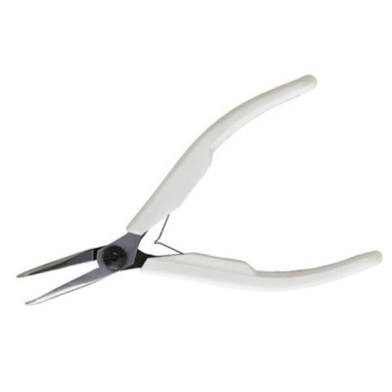 May include: Needle-nose pliers with a white handle. The pliers have a black pivot and silver-colored jaws. The handles are curved for a comfortable grip. These pliers are used for jewelry making, crafting, and other precision tasks.