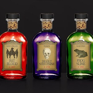 May include: Three glass bottles with cork stoppers, each filled with a different colored liquid: red, purple, and green. Each bottle has a label with a spooky theme, including a bat, skull, and frog. The labels read "Bat Blood," "Deadly Strychnine," and "Frog Slime."