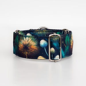 May include: A wide dog collar with a colourful floral pattern. The collar features a dark blue background with a design of yellow, orange, and blue flowers. It has a silver metal buckle and D-ring.