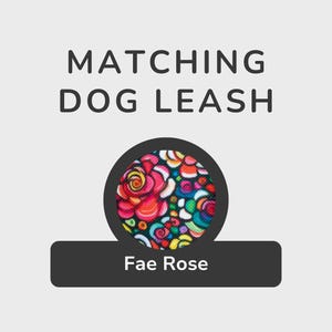 以下が含まれることがあります： 画像には、「MATCHING DOG LEASH」というテキストが、カラフルな花柄の円形デザインの上に表示されています。デザインの下には、「Fae Rose」というテキストが入った黒い長方形があります。デザインには赤、ピンク、青、黄色が含まれています。