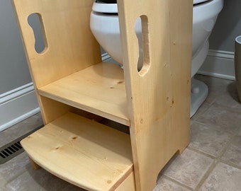 Get up and GO Potty Helper Two-Step Stool in Golden Pecan.  Has handles for easy use. Sturdy and SAFE, glued and screwed. Fits your toilet!