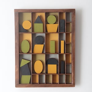 Decorative Geometric Artwork of Vintage Coloured Wooden Blocks & Shapes in Antique Printers Tray Cabinet