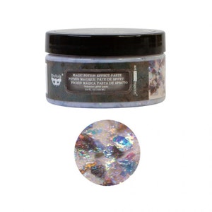 May include: A 3.4 fl oz (100 ml) jar of iridescent glitter paste labeled "Magic Potion Effect Paste". The paste is a light blue color with a shimmery finish. The jar has a black lid and a label with the text "Art Vagance" on the side.
